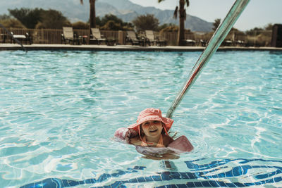 Portrait of man swimming in pool