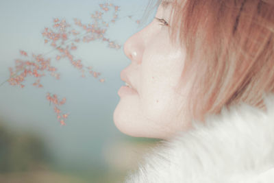 Close-up portrait of woman looking away