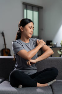 Young woman exercising at gym