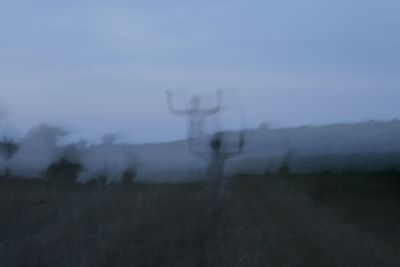 Electricity pylon on field