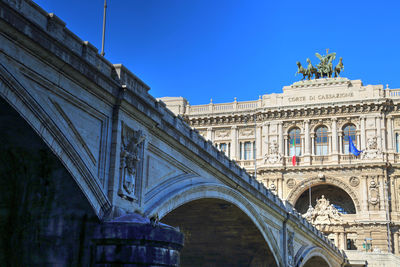 Low angle view of historical building against blue sky