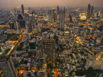 High angle view of illuminated modern buildings in city