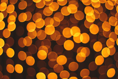 Defocused image of illuminated lights at night