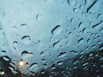 Full frame shot of raindrops on window