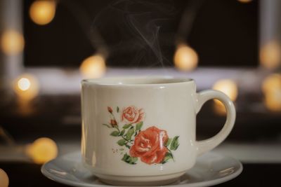 Close-up of coffee cup on table