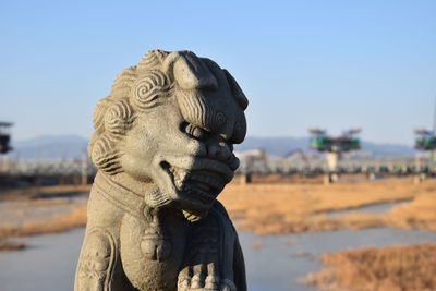 Close-up of statue against the sky