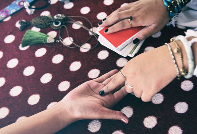 High angle view of woman hand with tattoo on hands