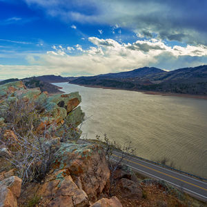 Scenic view of landscape against cloudy sky