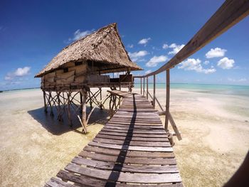 Lifeguard hut on beach against clear sky