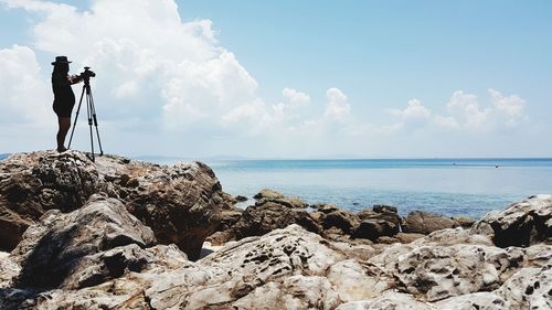 Scenic view of rocks and sea against sky