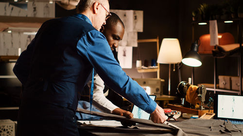 Side view of man working at home