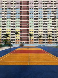 Soccer court against buildings in city