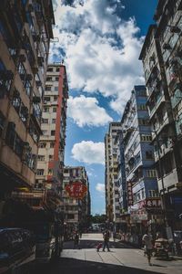 City street amidst buildings against sky