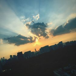 Low angle view of building against sky at sunset