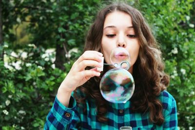 Close-up of a girl with bubbles