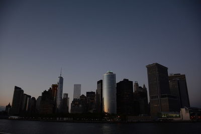 View of skyscrapers lit up at night