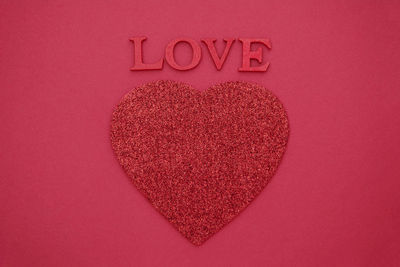 Close-up of heart shape on red cake