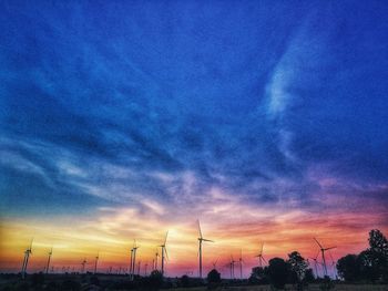 Low angle view of silhouette trees against sky during sunset