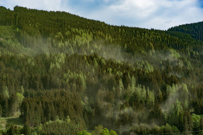 Panoramic view of waterfall against sky