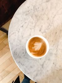 High angle view of cappuccino on table