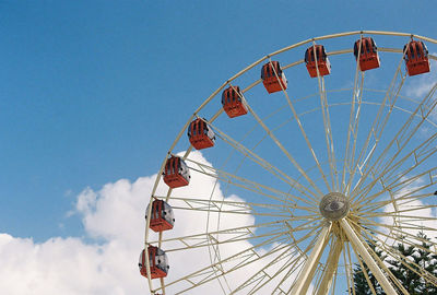 Low angle view of ferris wheel against sky