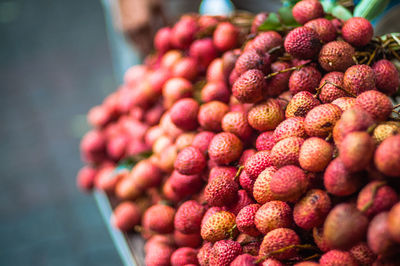High angle view of lychees for sale at market stall