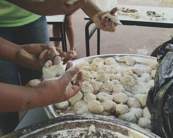 Close-up of man preparing food