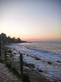 Scenic view of sea against clear sky during sunset