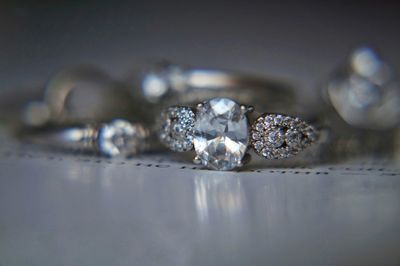 Close-up of wedding rings on table