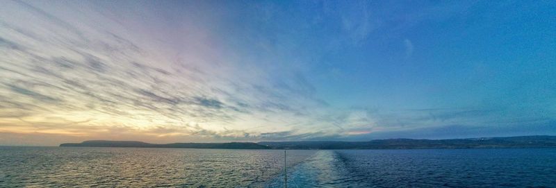 Scenic view of sea against sky at sunset