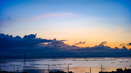 Scenic view of sea against sky during sunrise