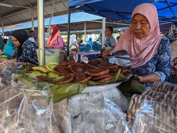 Woman buying food at market
