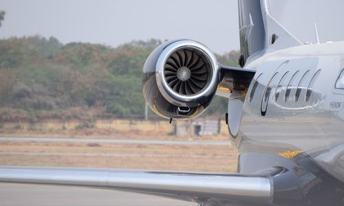 Close-up of airplane on airport runway