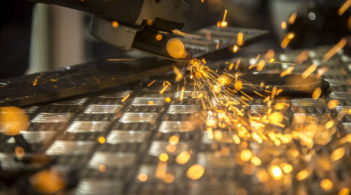 Close-up of metal being cut with handsaw