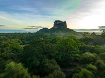 Scenic view of landscape against sky during sunset