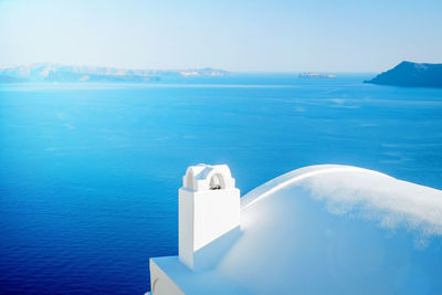 Scenic view of swimming pool by sea against sky