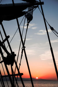 Silhouette of swing at sunset