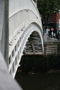 Close-up of built structure with water in foreground