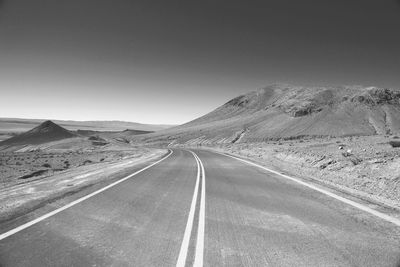 Empty road along landscape