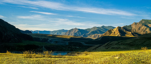 Scenic view of landscape and mountains against sky