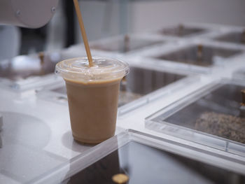 Close-up of coffee drink on table