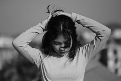 Portrait of young woman looking away