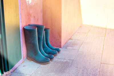 Row of garbage can against wall