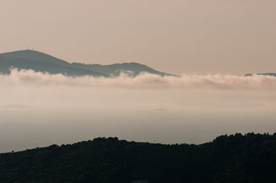 Scenic view of silhouette mountain against sky during sunset