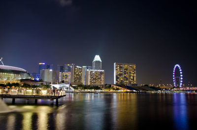 Illuminated buildings in city at night