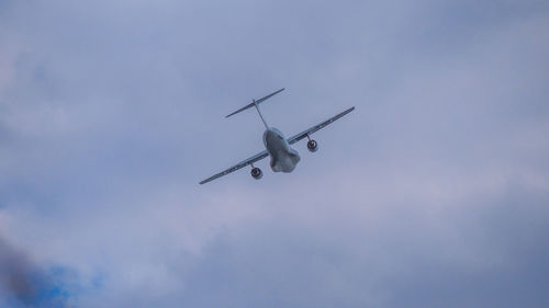 Low angle view of airplane against sky