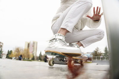 Mature man skateboarding at park