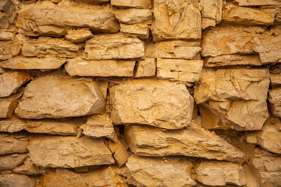 Full frame shot of stack of stone wall