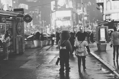Woman standing on city street