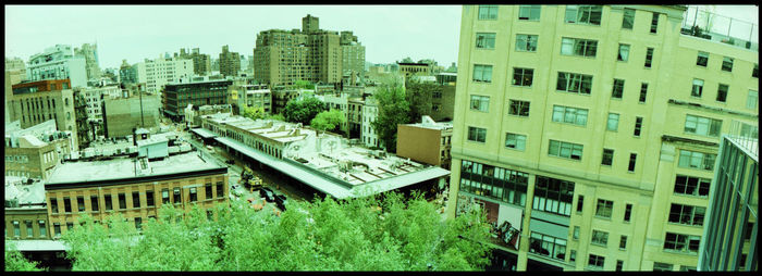 High angle view of buildings in city against sky